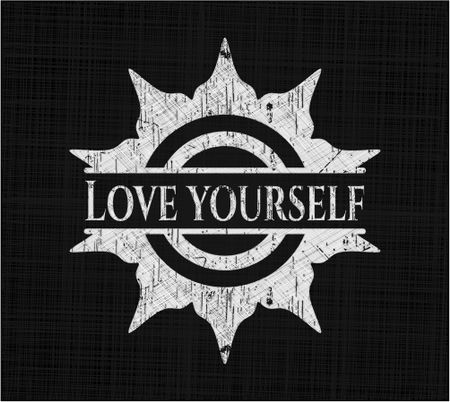 Love Yourself chalk emblem written on a blackboard