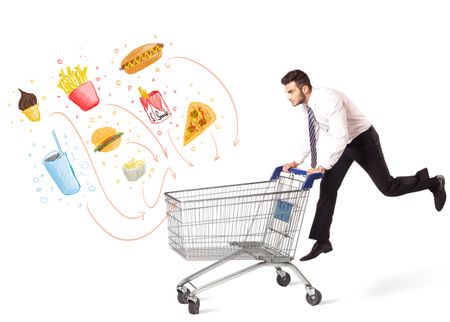 Businessman pushing a shopping cart and toxic junk food and cigarettes coming out of it