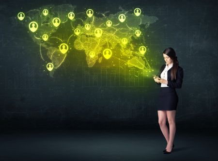 Businesswoman in office with tablet and social network world map concept on background