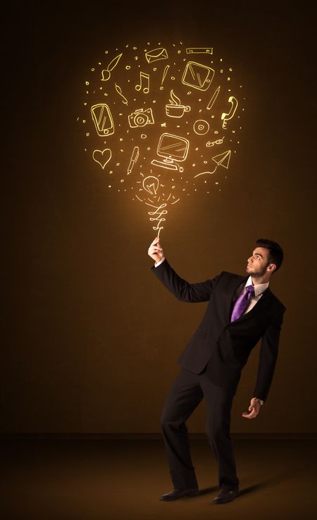 Businessman holding a social media shining balloon on a brown background