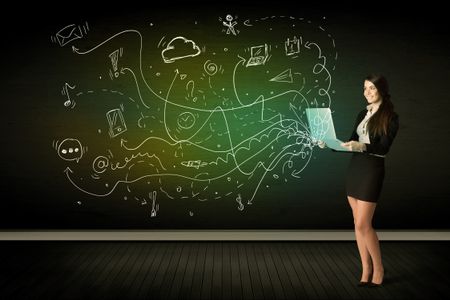 businesswoman-sitting-chair-holding-laptop-media-373648402 Businesswoman sitting in chair holding laptop with media icons concept on background