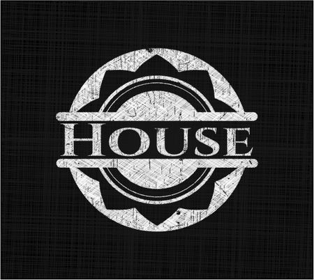 House chalkboard emblem on black board