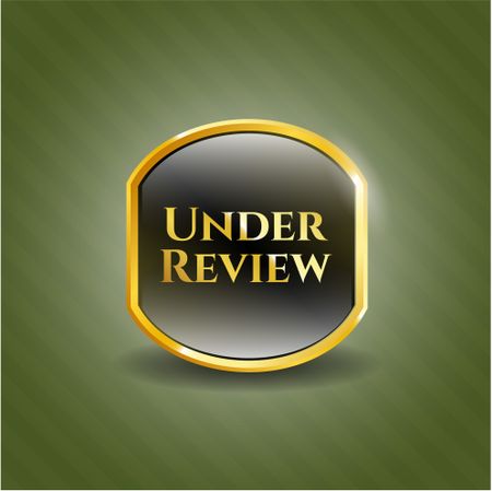 Under Review gold emblem