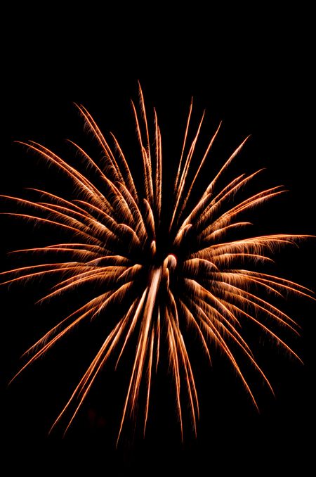 Single burst of fireworks with feathery streaks