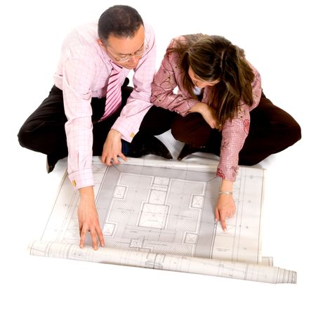 couple planning their house on a blueprint