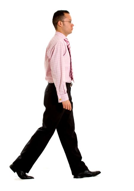 Business man walking from one side of the frame to the other - isolated over a white background