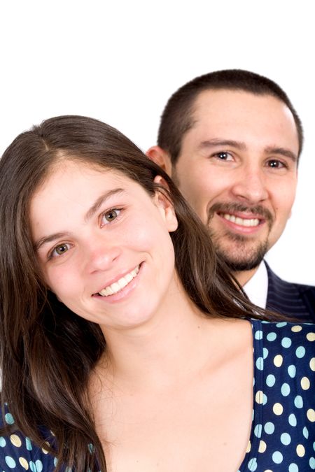 young couple smiling and standing next to each other - isolated over a white background