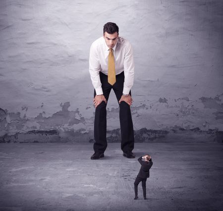 Angry big manager looking at small business man concept on background