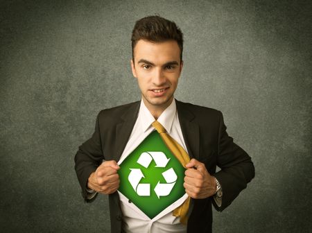 Enviromentalist business man tearing off shirt with recycle sign on his chest concept on backround