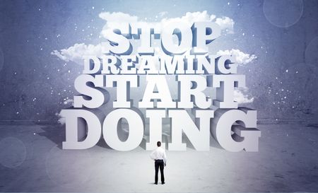 A lazy sales person standing in emty space with huge block letters illustration saying stop dreaming start doing and clouds concept