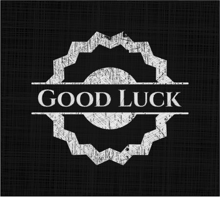 Good Luck chalkboard emblem on black board