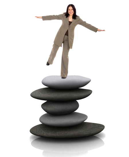 Business woman balancing over stones snd smiling isolated