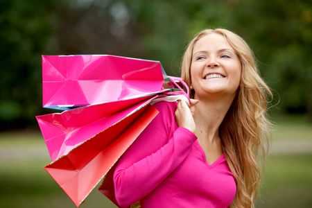Beautiful woman portrait with shopping bags outdoors