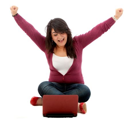 Excited woman with a laptop isolated on white