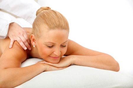 Woman enjoying a massage on her back isolated