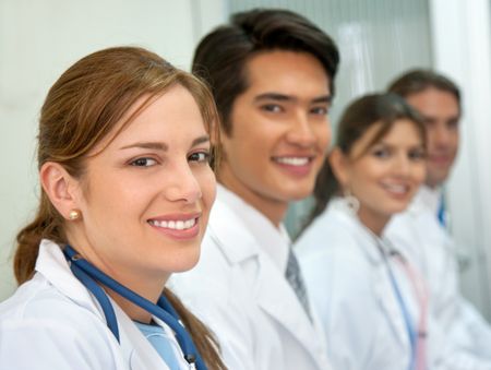 Cheerful medical team smiling at a hospital