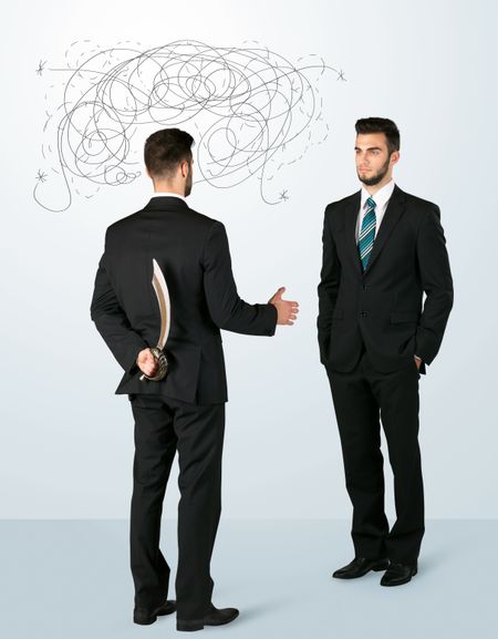 ruthless-businessman-hiding-weapon-weaving-plan-379642912 Ruthless businessman hiding a weapon and weaving plan around his head