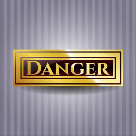 Danger gold emblem or badge