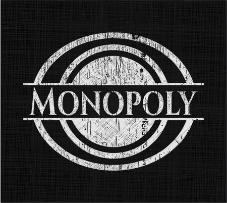 Monopoly chalk emblem written on a blackboard