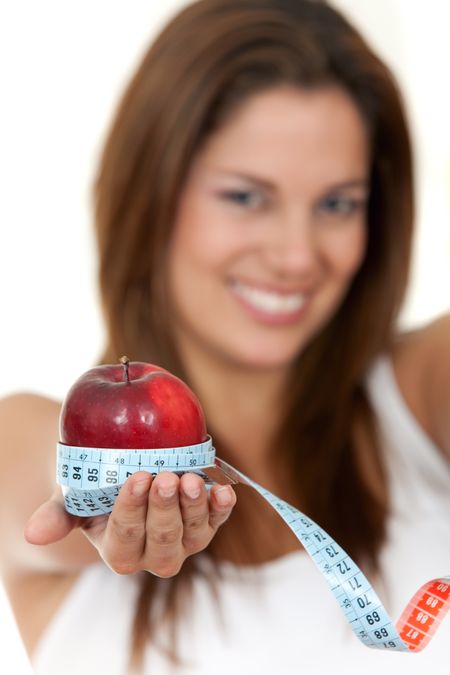 Woman with apple and measure tape isolated