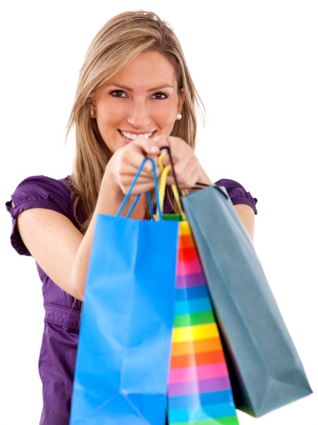 Happy woman portrait with shopping bags isolated
