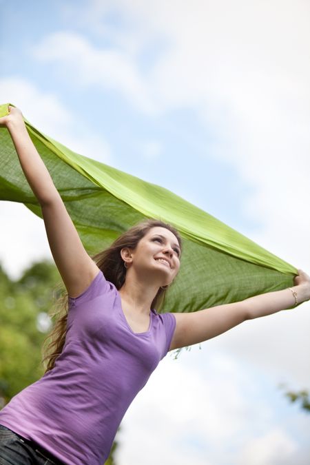 Beautiful woman with a pashmina feeling the wind