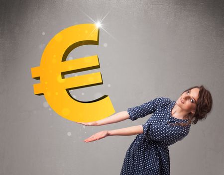 Beautiful young girl holding a big 3d gold euro sign