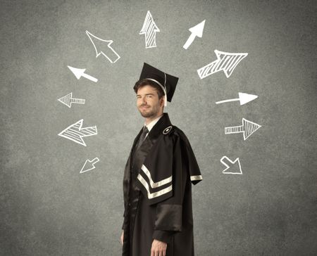 Young graduate student with hand drawn arrows on wall 