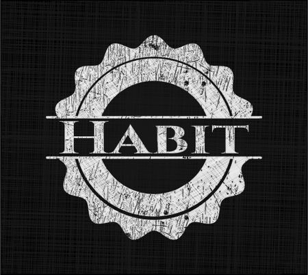 Habit chalk emblem written on a blackboard