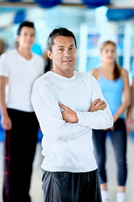 Man at the gym in front of a group