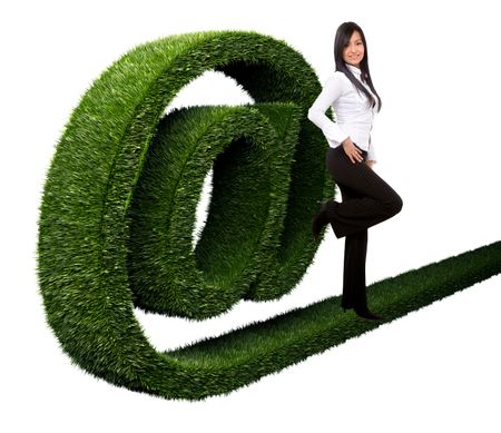 Business woman with an 'at' symbol in grass isolated