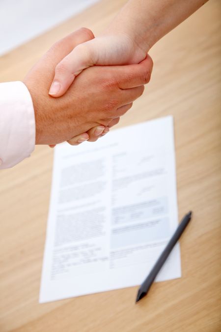 Close up of a business handshake in an office