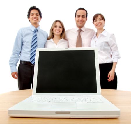 Business team with a laptop isolated on white