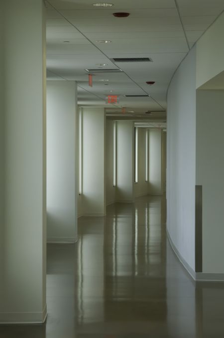 Curved hallway at community college with main light coming through windows
