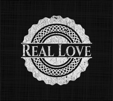 Real Love chalk emblem written on a blackboard