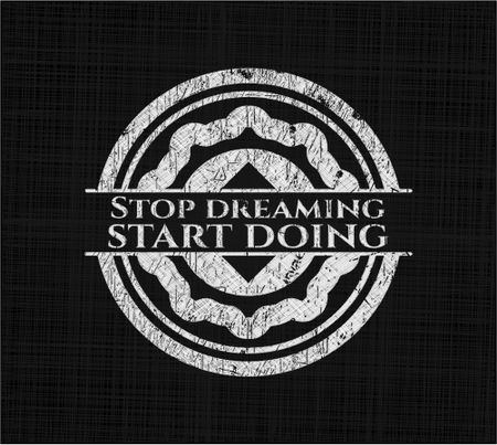 Stop dreaming start doing on chalkboard