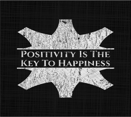 Positivity Is The Key To Happiness chalk emblem written on a blackboard