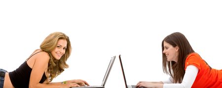 Women lying on the floor with computers isolated