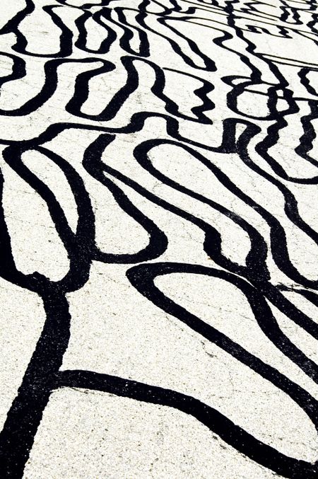 Street grunge: maze of sealant on cracked asphalt