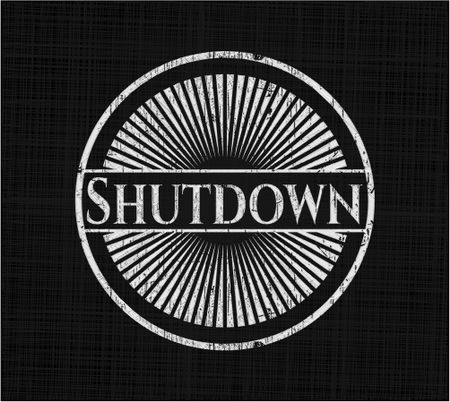 Shutdown chalk emblem written on a blackboard