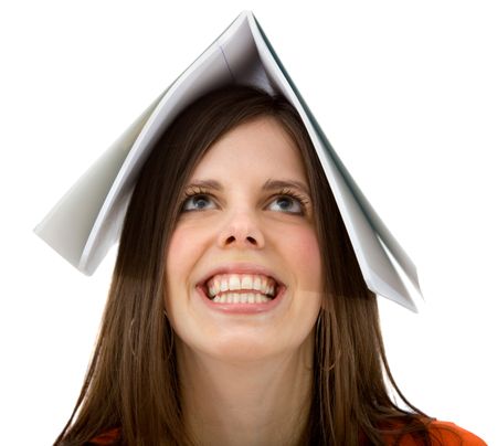 Woman with a book on her head isolated