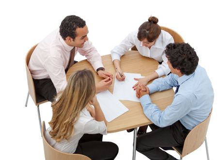 Business people working around a table isolated