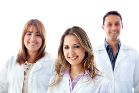 Group of doctors smiling isolated on white