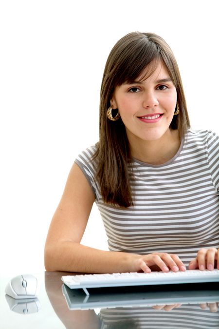 Young woman working on the computer isolated on white