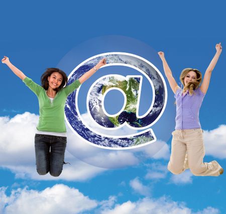 women jumping with an at sign and sky as background