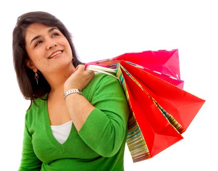 Pensive woman with shopping bags isolated on white