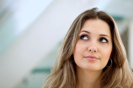 Portrait of a beautiful thoughtful woman indoors