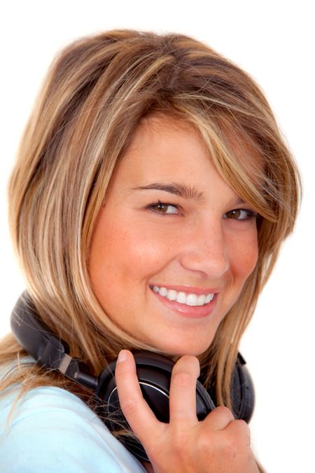 Beautiful woman portrait with earphones isolated on white