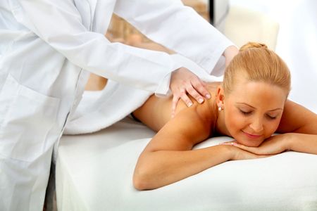 Woman at a spa having a massage on her back