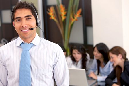 Customer support operator man smiling at an office